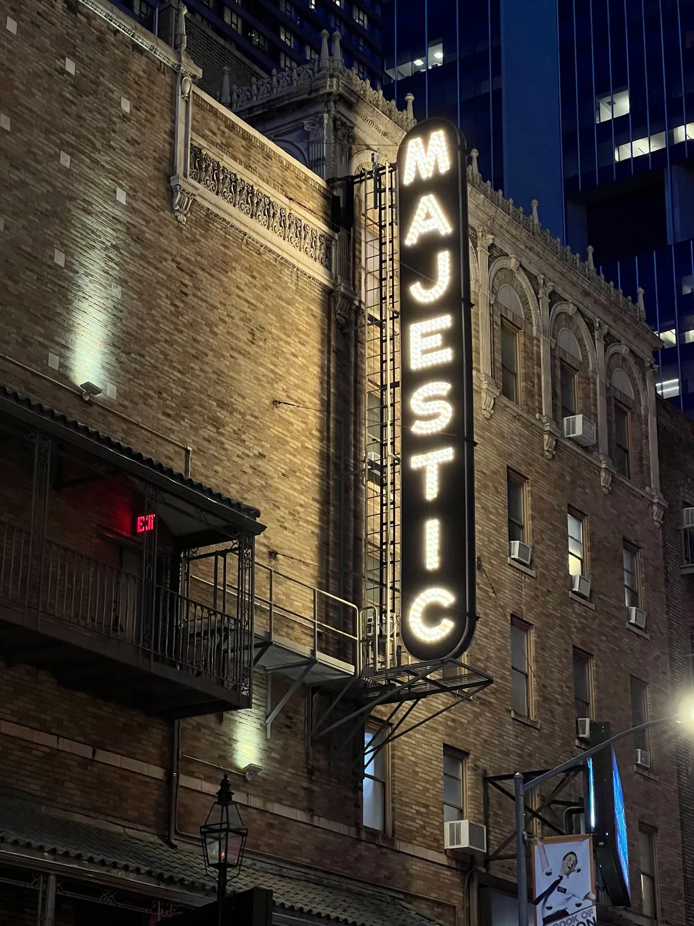 The lit Majestic theater marquee at night.